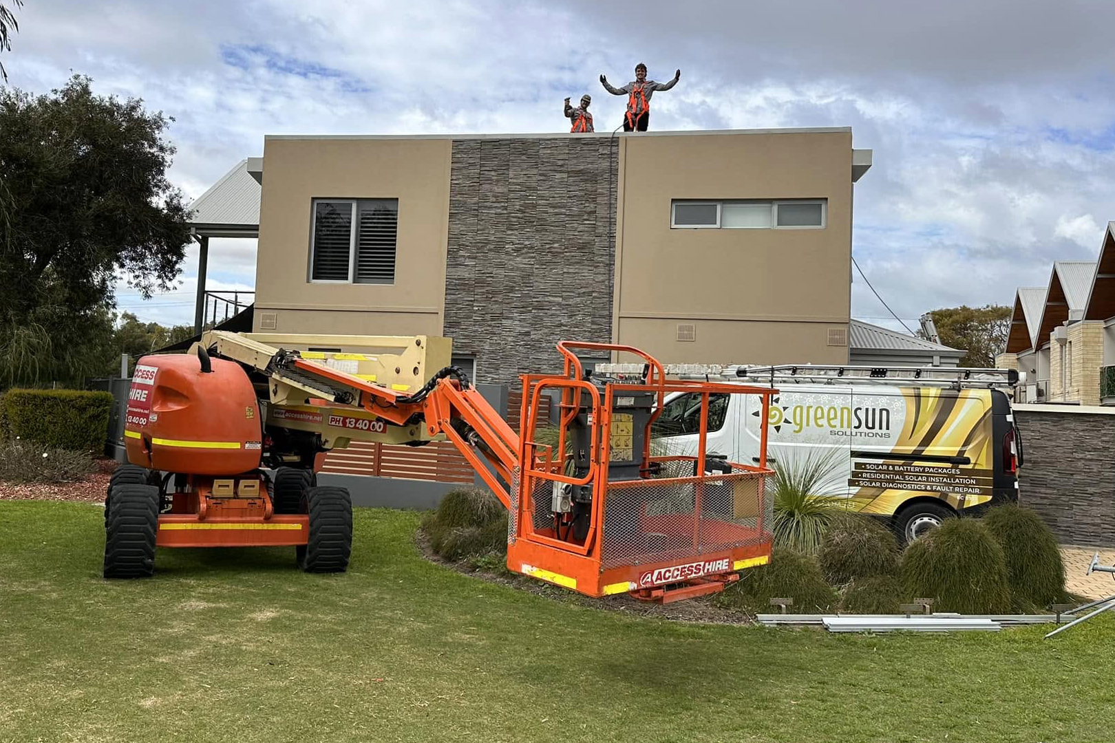 Green Sun Solutions solar installation team Green Sun Solutions installers working safely on a roof