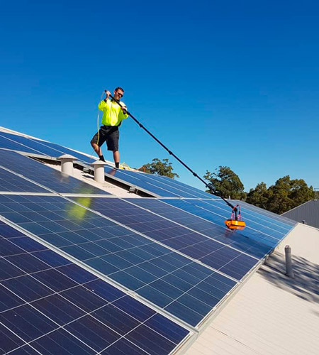 Solar panel cleaning Green Sun Solutions installer cleaning solar panels